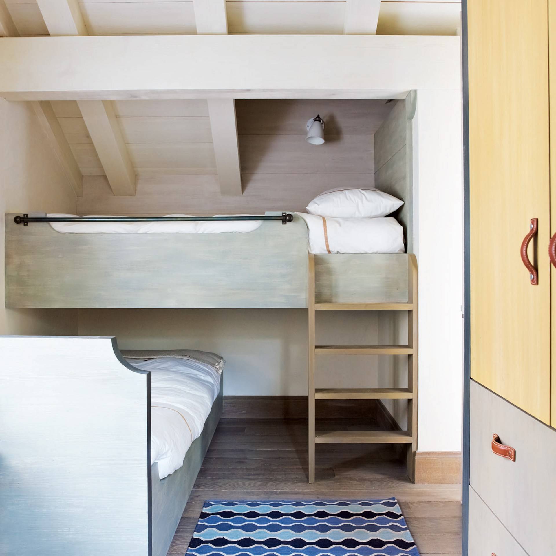 bunk bed with cubby underneath